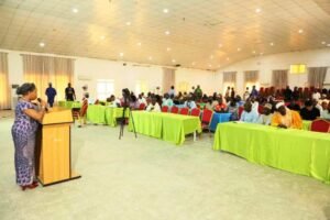Dr. Vivian Okono, Director Mines Environmental Compliance Department addressing Mineral Title Holders, Mining Host Communities & Relevant Stakeholders during a Sensitisation Workshop on behalf of the Permanent Secretary, Ministry of Solid Minerals Development