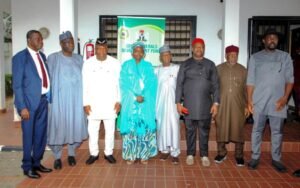 The Chairman, Senate Committee on Solid Minerals, Sen. Sampson Ekong (3rd left), Vice Chairman of the Senate Committee on Solid Minerals, Sen. Kabeeb Mustapha (4th right), Executive Secretary, Solid Minerals Development Fund (SMDF), Hajia Fatima Shinkafi (middle) and other members of the Committee during their oversight visit to SMDF