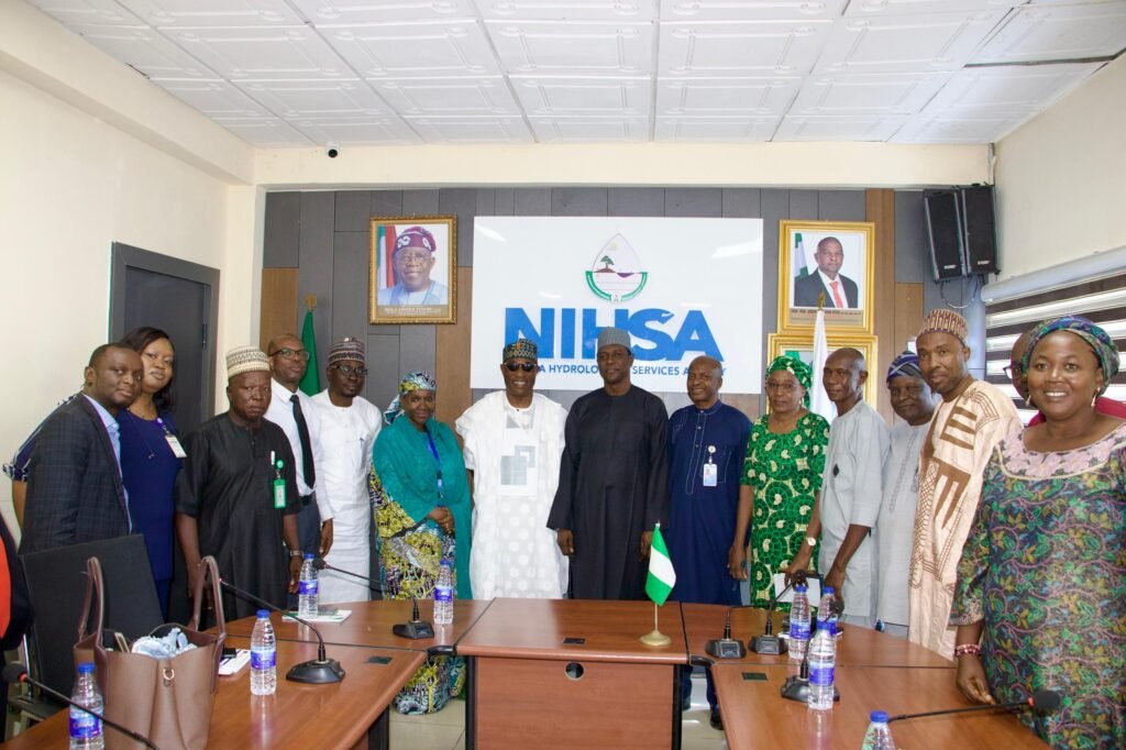  The Executive Director,  NIWRMC, Dr Abdulmumini Aminu Zaria (7th L) and the Director General of NIHSA, Umar Ibrahim Muhammed (7th R) with staff of both Agencies in Abuja