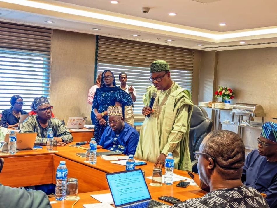 Honourable Minister of State for Health & Social Welfare Dr. Adekunle Salako addressing members of the National Health Research Ethics Committee NHREC, during its 2026 Face- to- Face meeting and Training Workshop in Abuja, and On his immediate right: Dr. Kamil Shoretire Director/Head, Health Planning Research Statistics Department FMoHSW, also On his immediate left: Professor Richard Adegbola Chairman NHREC.