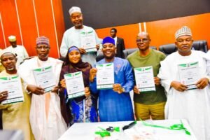 Hon. Minister of Education, Dr Maruf Olatunji Alausa (M) along with Hon Minister of State for Educationn; Prof. Suwaiba Sa'id Ahmed and others unveiling agreements between the Federal Government of Nigeria and the Academic Staff Union of the Universities 