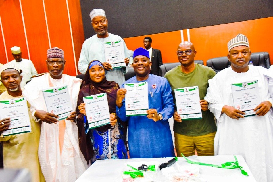 Hon. Minister of Education, Dr Maruf Olatunji Alausa (M) along with Hon Minister of State for Educationn; Prof. Suwaiba Sa'id Ahmed and others unveiling agreements between the Federal Government of Nigeria and the Academic Staff Union of the Universities 