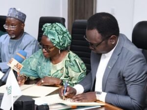 The Honourable Minister of Youth Development, Comrade Ayodele Olawande, Permanent Secretary Dr. Maryam Ismaila Kenshiro, and the Director, Education and Youth Development (EYD), Kabiru Mohammed, at the signing of a landmark MoU with the Africa Projects Development Centre (APDC) to revitalize Youth Development Centres nationwide, in Abuja.